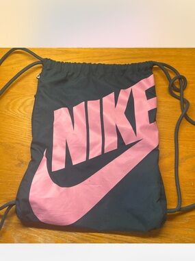 Nike Black Drawstring Backpack with Pink Logo